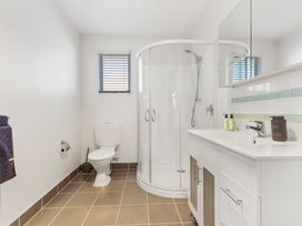 A bathroom with a shower and sink at All Year Round Adventure Base - National Park
