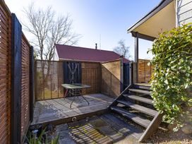 A garden with a table and stairs at All Year Round Adventure Base - National Park