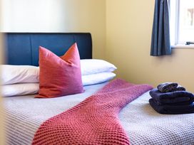 A bedroom with a bed and pillows at All Year Round Adventure Base - National Park