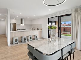 A kitchen with a dining table and flowers at Repora Holiday Home in Repora