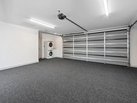 A garage with a washer and dryer at Repora Holiday Home in Repora