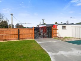 An outdoor area with a gate and fence at Reporoa Holiday Home in Reporoa