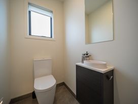 A bathroom with a toilet and sink at Te anau Holiday home in Te Anau