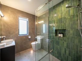 A bathroom with a sink and toilet at Te anau Holiday home in Te Anau