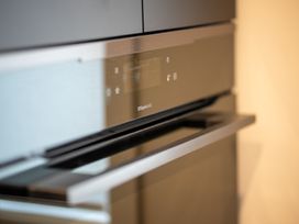 A steam oven with a control panel in a kitchen at Te anau Holiday home Te Anau