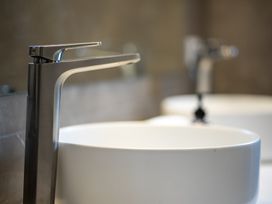 A bathroom with a faucet and bowl sink at Te anau Holiday home in Te Anau