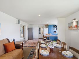 A dining room with a table set for a meal at Akaroa Holiday Home