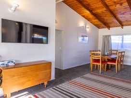 A dining room with a table and chairs at Railside Chalet - Raurimu Holiday Home National Park