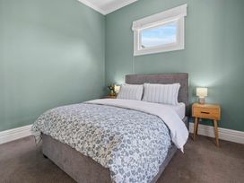 A bedroom with a bed and bedside table at The Old Barn in Manchester