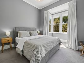 A bedroom with a bed and a bedside table at the property in location
