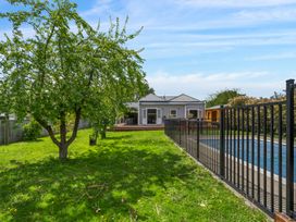 A garden with trees and swimming pool at an unspecified property location