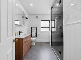 A bathroom featuring a sink, toilet, and shower at 