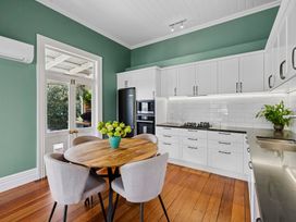 A kitchen with a round table and chairs at a property