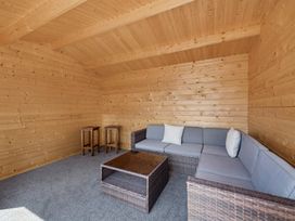 A snug with a sofa and a coffee table at 