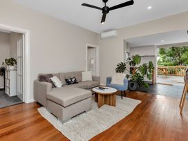 A living room with a sofa and coffee table at Chic Whangarei Retreat - 10 min Walk to CBD in Whangarei