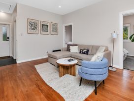A living room with a couch and coffee table at Chic Whangarei Retreat - 10 min Walk to CBD Whangarei