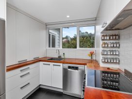 A kitchen with a sink and a dishwasher at Chic Whangarei Retreat - 10 min Walk to CBD Whangarei
