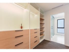 A closet with drawers and shelves at Horizon View Retreat - Nelson Holiday Home