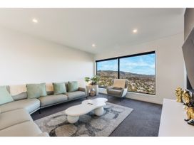 A living room with a sofa and coffee table at Horizon View Retreat - Nelson