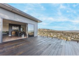 An outdoor deck with a view at Horizon View Retreat - Nelson Holiday Home in Nelson