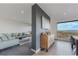 A living room with a sofa and coffee table at Horizon View Retreat - Nelson