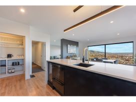 A kitchen with a sink and counter at Horizon View Retreat - Nelson Holiday Home