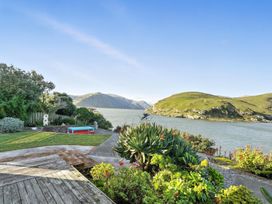 A garden with seating and water view at Birdlings Flat in Banks Peninsula