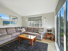 A living room with a sofa and coffee table at Birdlings Flat in Banks Peninsula