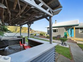 An outdoor area with a seating and barbecue at Birdlings Flat Banks Peninsula