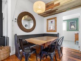 A dining room with a table and chairs at Ohakune Holiday Home in Ohakune