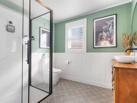 A bathroom with a shower, toilet, and sink at Ohakune Holiday Home in Ohakune