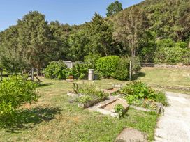 A garden with plants and vegetable patches at Hill Cottage - Featherston