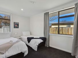 A bedroom with two beds and a window at Antimony Retreat - Cromwell