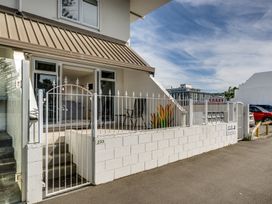 An outdoor area with a gate and steps at Sea-renity - Napier Holiday Home, Napier South