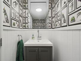A bathroom with a sink and mirror at 