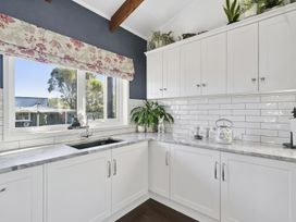 A kitchen with a sink and cabinets at The Old Barn in Manchester