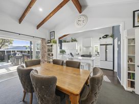 A dining room with a wooden table and chairs at The Old Barn in Manchester