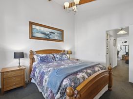 A bedroom with a bed and bedside tables at the property in location