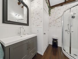 A bathroom with a shower and sink at The Old Barn in Manchester