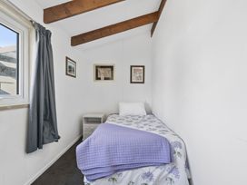 A bedroom with a bed and bedside table at The Old Barn in Manchester