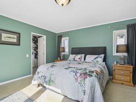 A bedroom with a bed and nightstand at The Old Barn in Manchester