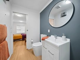A bathroom with a sink and toilet at Cosy Studio Retreat - Wellington