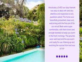 A garden with a pool and flowers at Dunluce Coastal Farmstay - Kaikoura