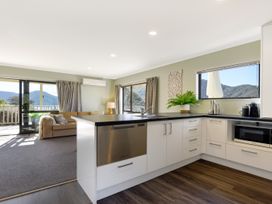 A kitchen with appliances and views at Charlotte's Cottage - Havelock Holiday Home in Marlborough
