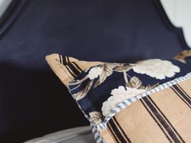 A pillow on a bed at The Shearers Quarters Clarence Farmstay in Kaikoura