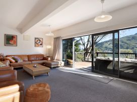 A living room with a sofa and coffee table at Koraha Serenity - Linkwater Holiday Home, Marlborough