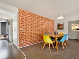 A dining room with a table and chairs at Koraha Serenity - Linkwater Holiday Home Marlborough