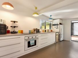 A kitchen with appliances and countertops at Koraha Serenity - Linkwater Holiday Home in Marlborough