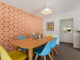 A dining room with a table and chairs at Koraha Serenity - Linkwater Holiday Home Marlborough