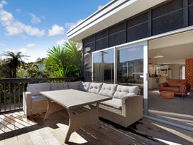 An outdoor patio with seating and a table at Koraha Serenity - Linkwater Holiday Home Marlborough